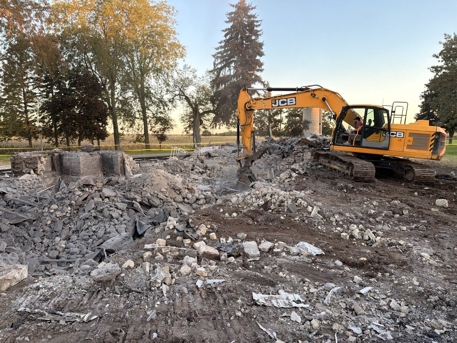 S&S Demolition excavator removing a residential structure