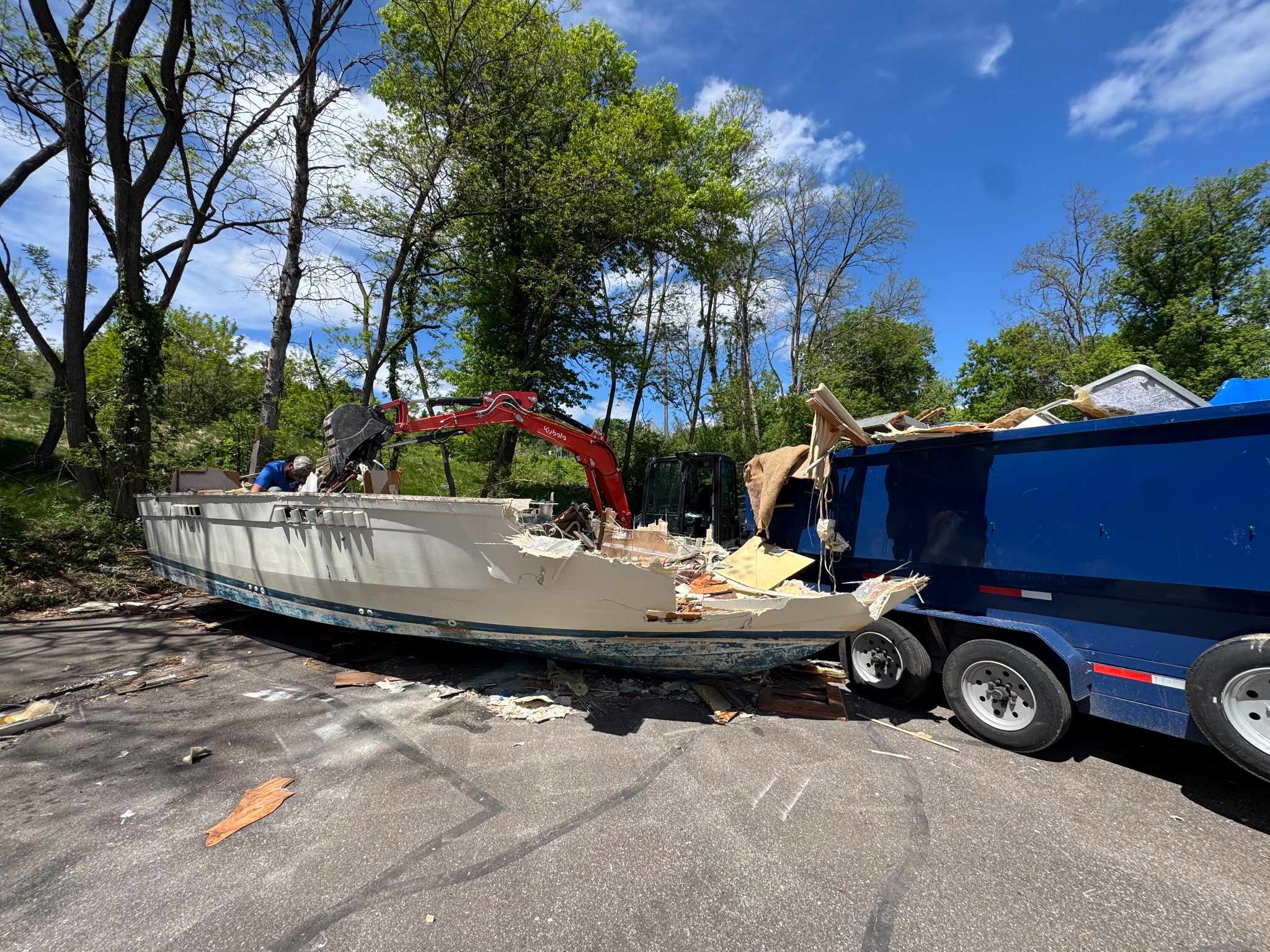 S&S Demolition dismantling and removing a large boat